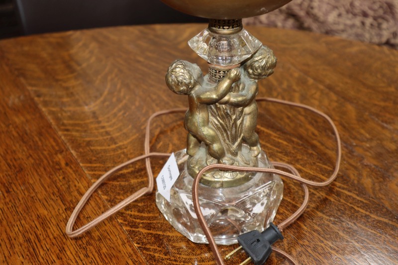 A pair of gilt metal cherub table lamps